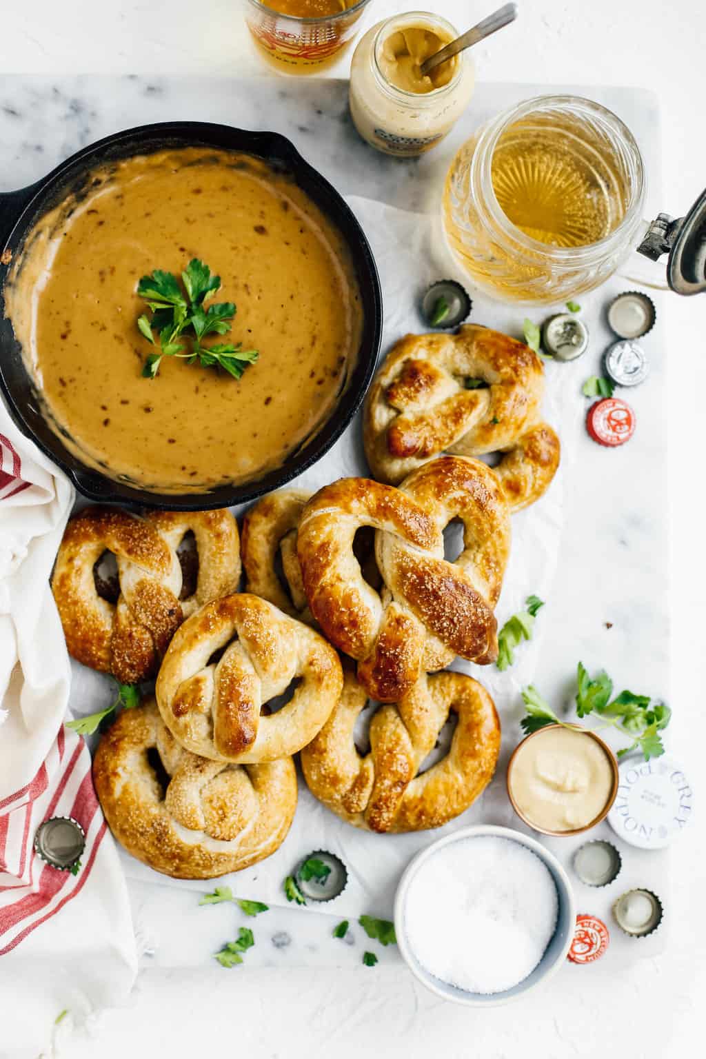 easy homemade soft pretzels with beer cheese dip in cast iron skillet