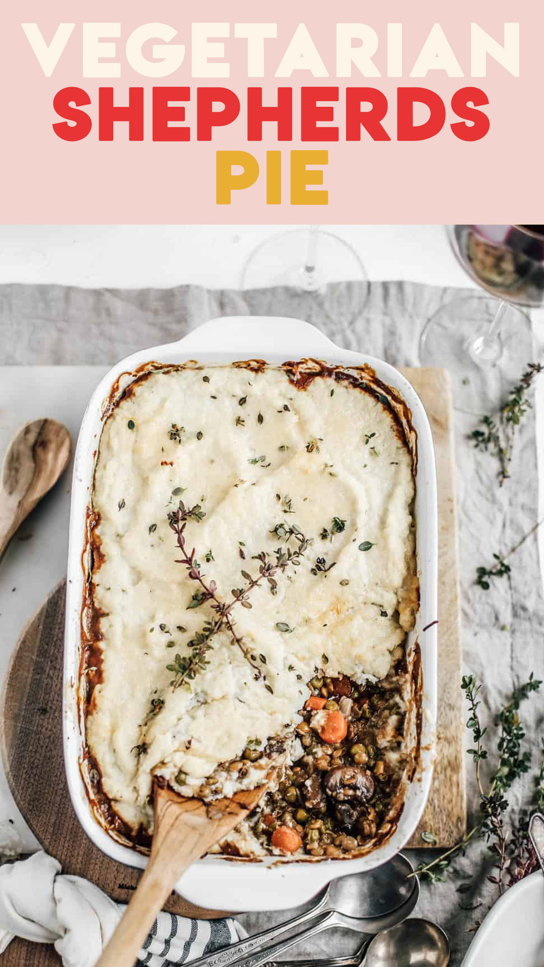 Casserole dish of Vegetarian Shepherds Pie with a wooden spoon. 