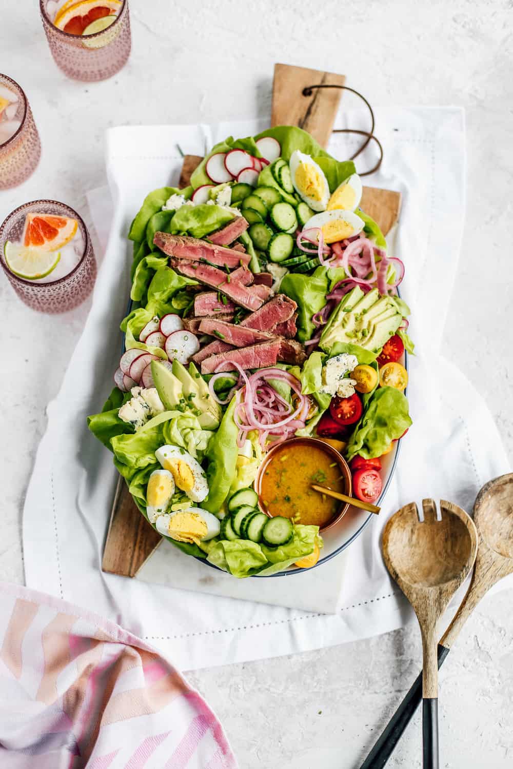 seared ahi tuna salad displayed on a brown serving platter