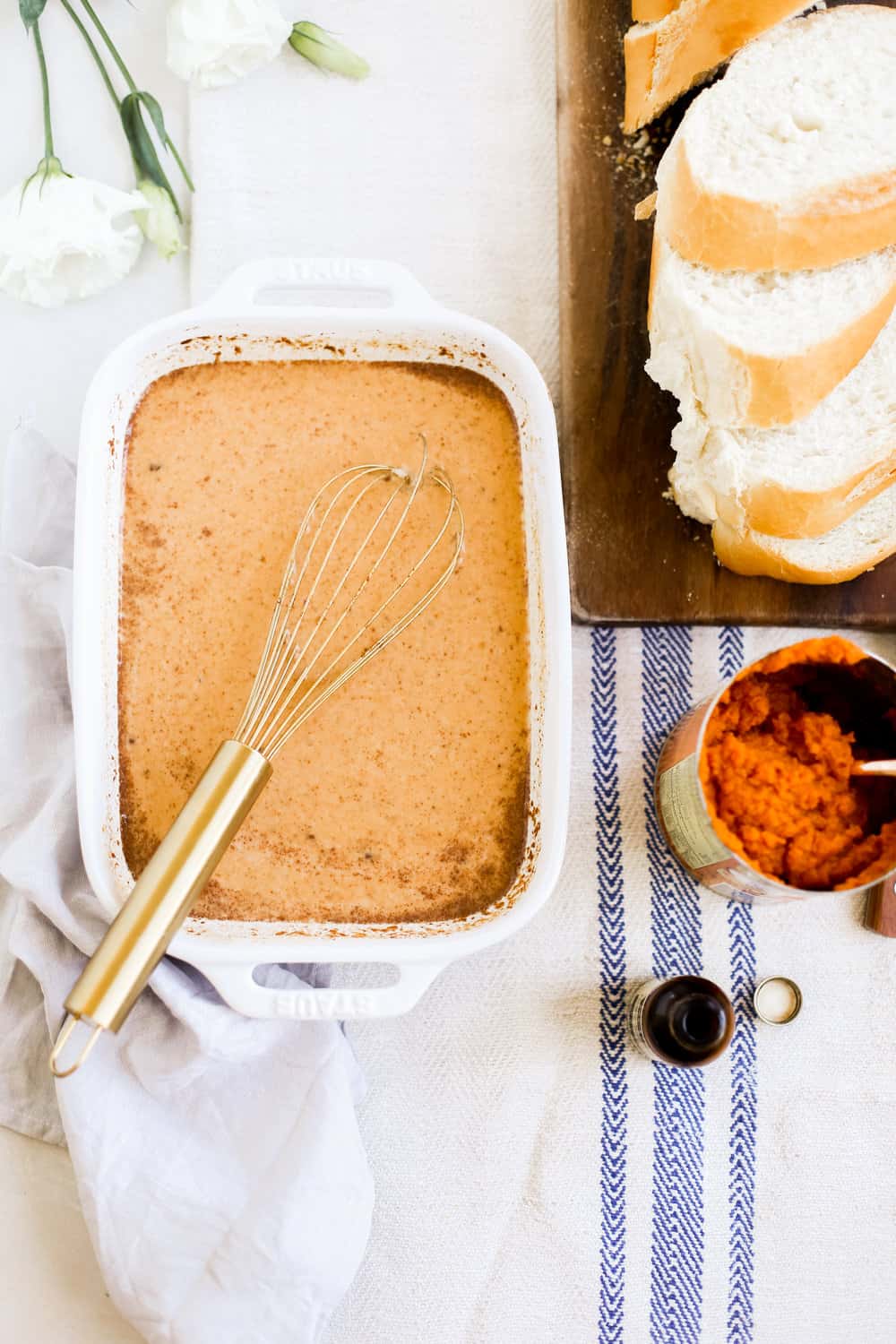 Pumpkin spice egg mixture with a whisk. 