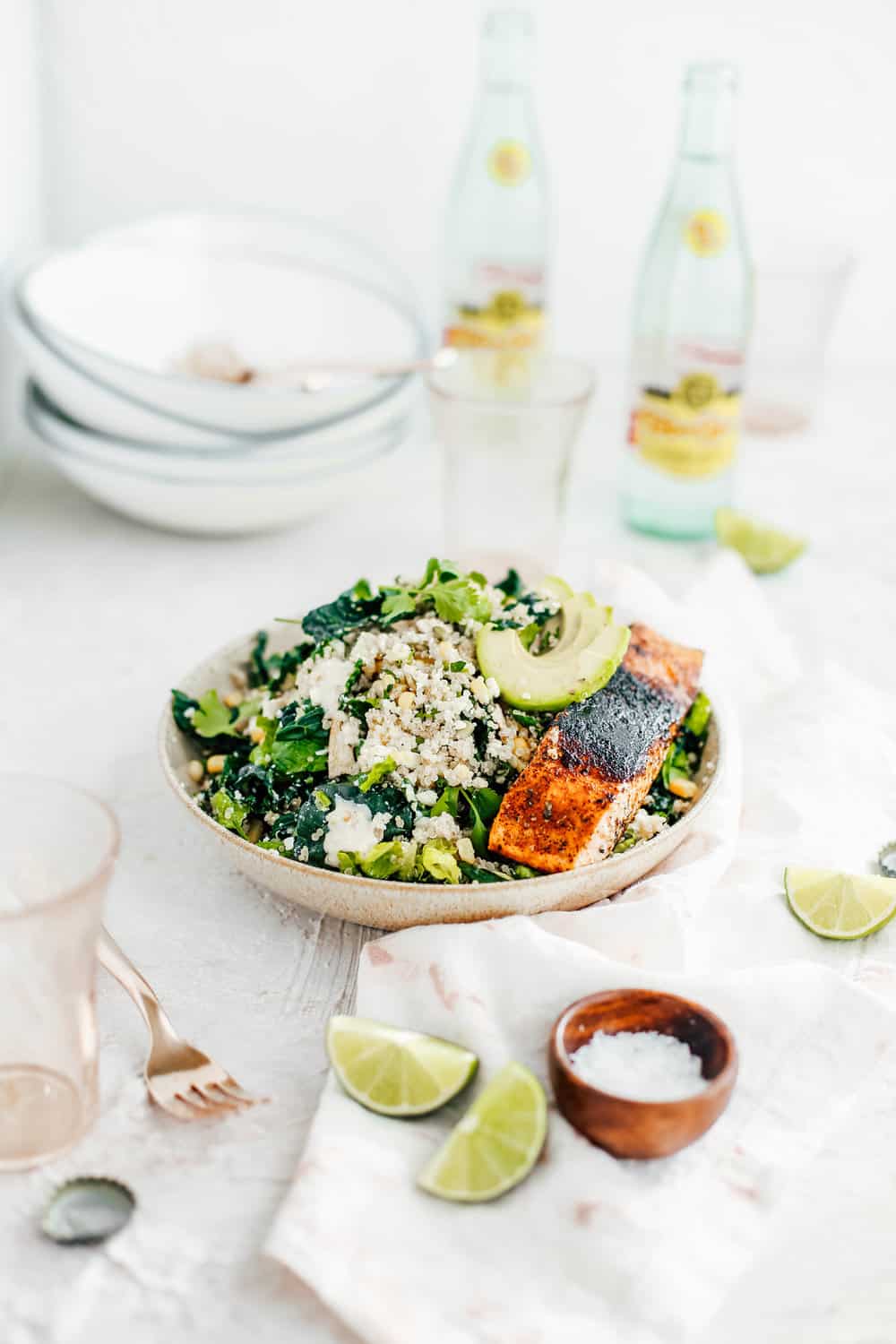 Kale Caesar Salad with Golden Corn Quinoa and Salmon in a Bowl