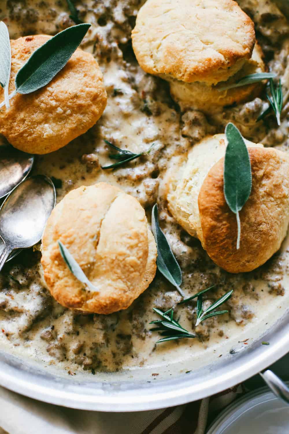 Close up shots of bourbon biscuits and sage sausage gravy. 