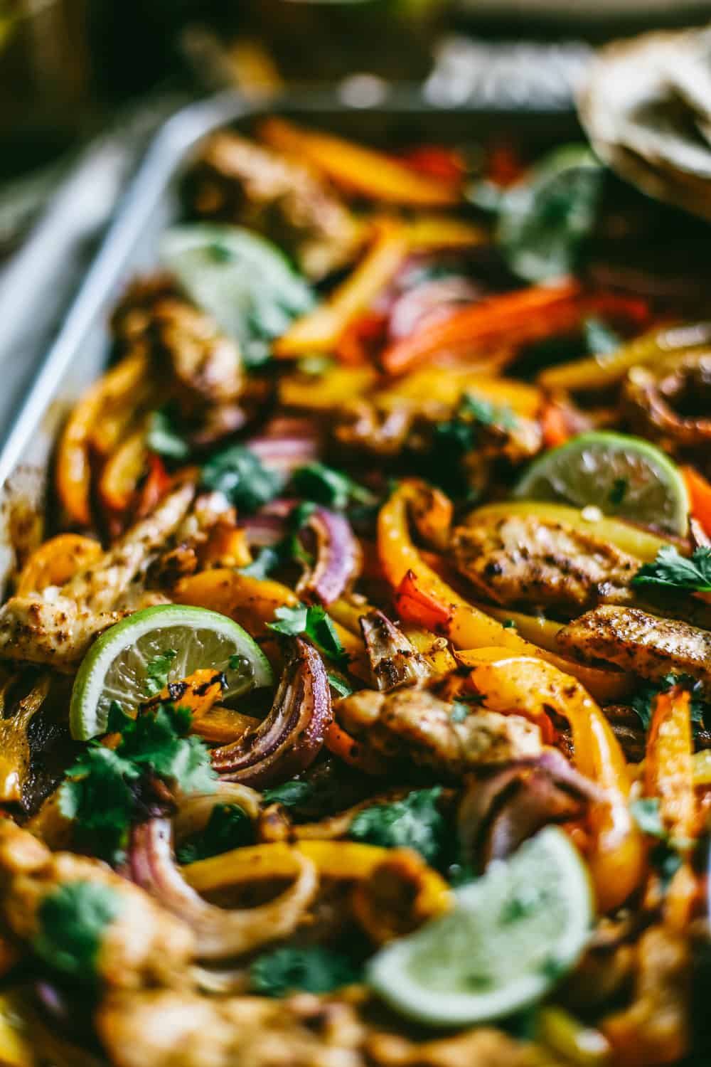 chili lime chicken and vegetables on a sheet pan