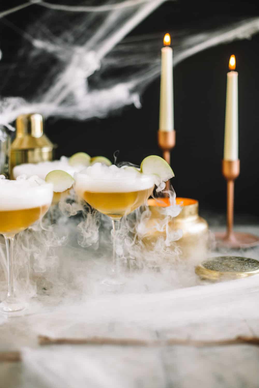 Elderflower wand martini with dry ice ,spider webs, and candle sticks. 