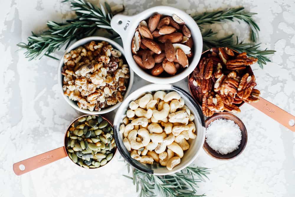 small bowls of different types of nuts.