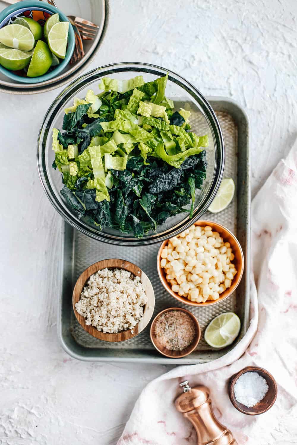 Kale Romaine Golden Corn Quinoa Salt and Lime Salad Ingredients in Mixing Bowls