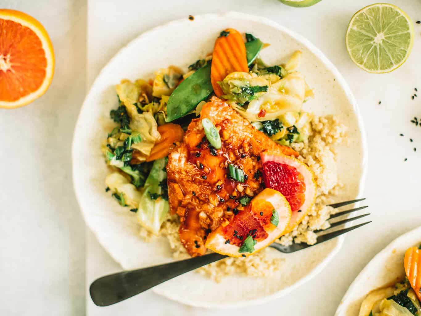 Your next weeknight dinner needs to be this blood orange salmon fillet with an easy ginger garlic stir fry. This is a tasy, flavorful and healthy recipe!