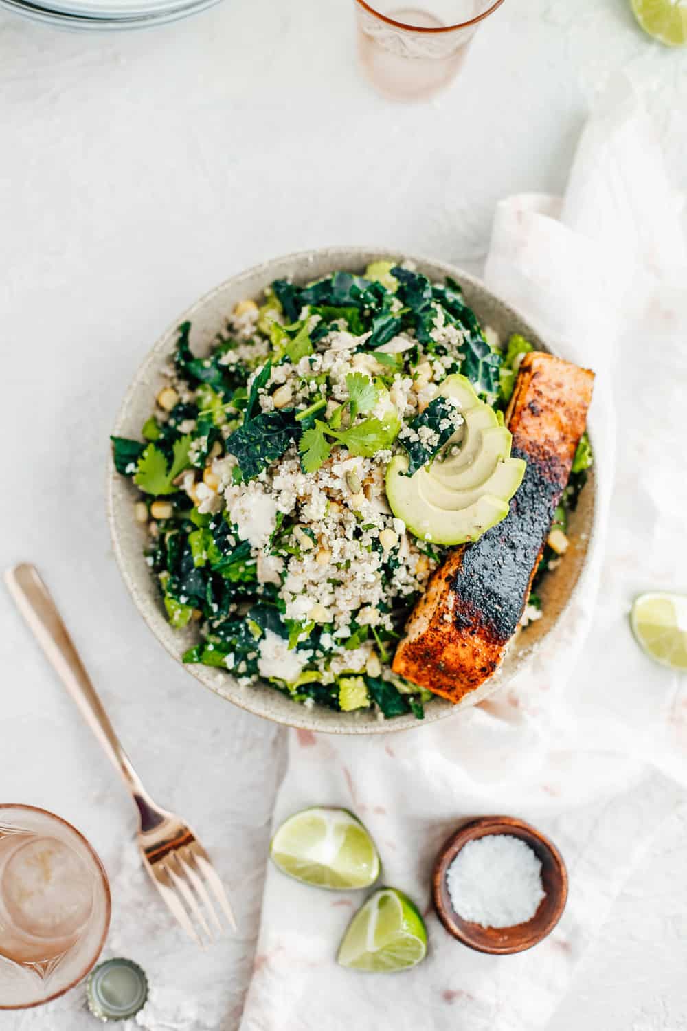 Kale Caesar Salad with Golden Corn Quinoa and Salmon in a Bowl