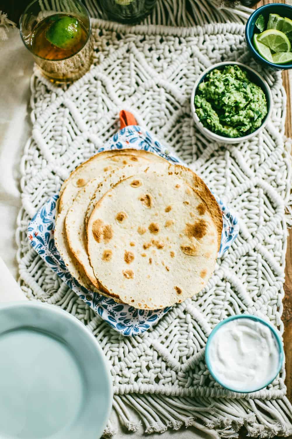 flour tortillas with bowl of guacamole on the side