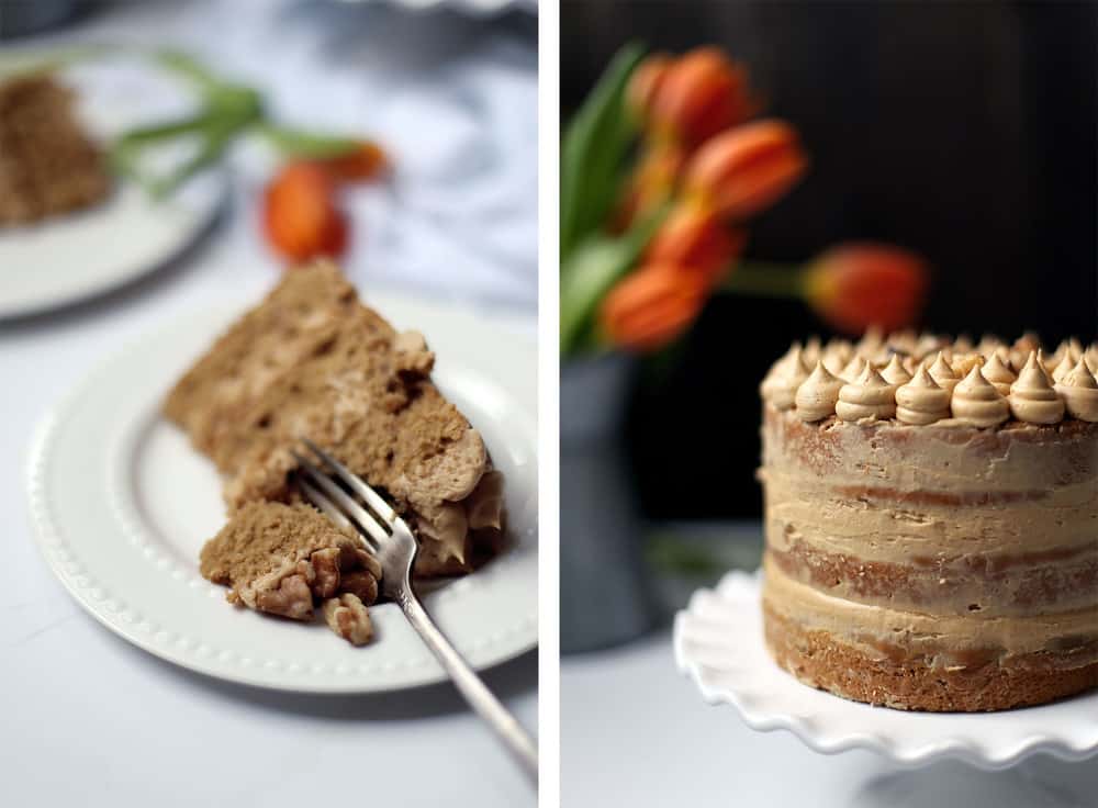 A slice of coffee walnut cake on a white plate with a silver fork. 