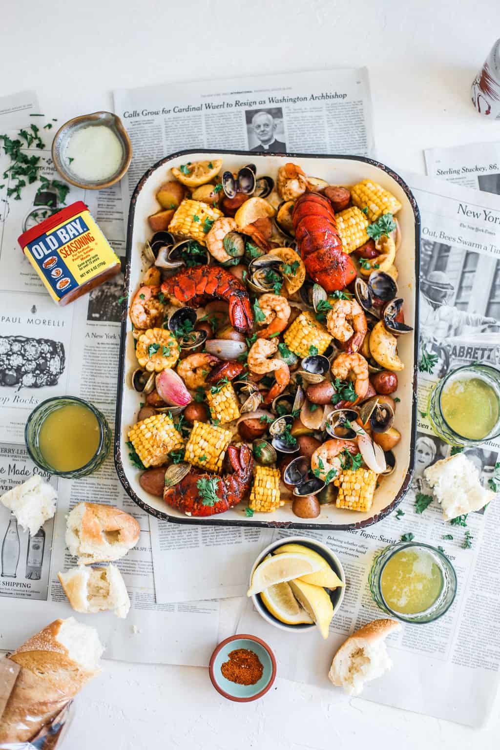 clams, shrimp, lobster, potatoes, corn on sheet pan with old bay and melted butter