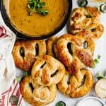 soft homemade pretzels with beer cheese dip in cast iron skillet