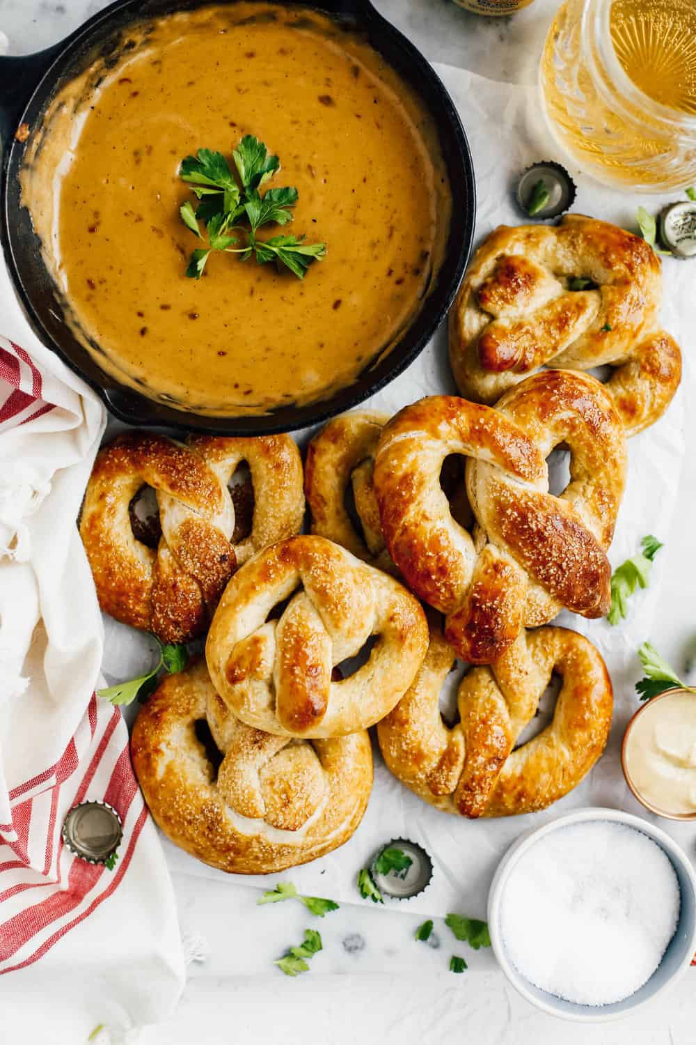 soft homemade pretzels with beer cheese dip in cast iron skillet