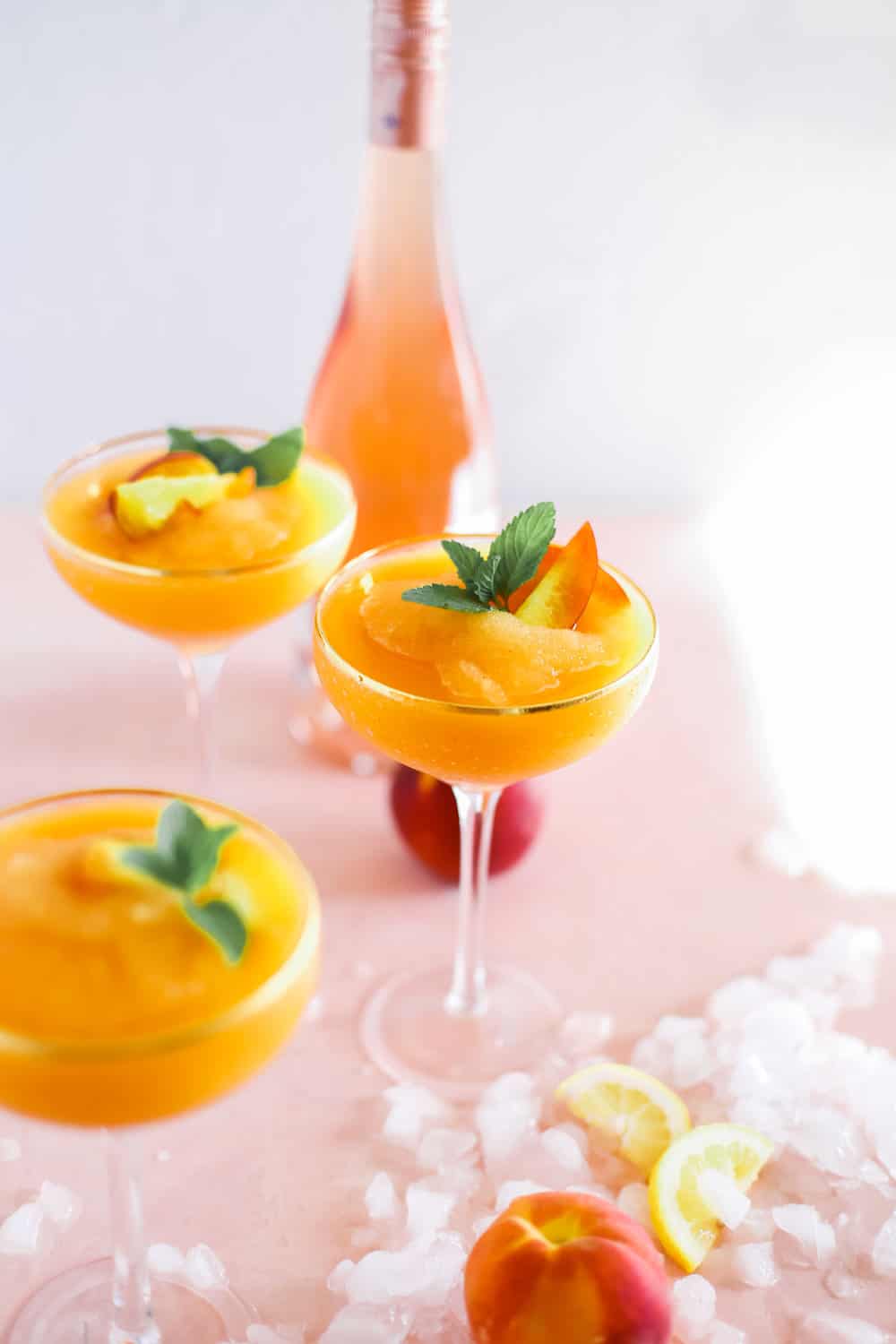 Strawberry Peach Frose in Coupe Glasses with Mint