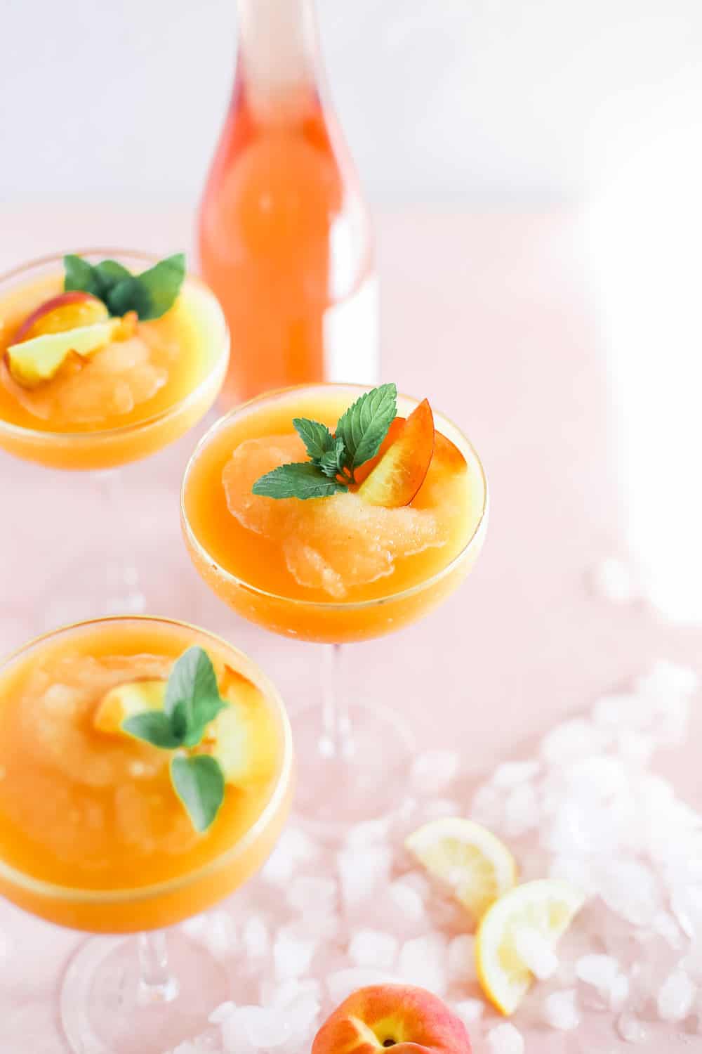 Strawberry Peach Frose in Coupe Glasses with Mint