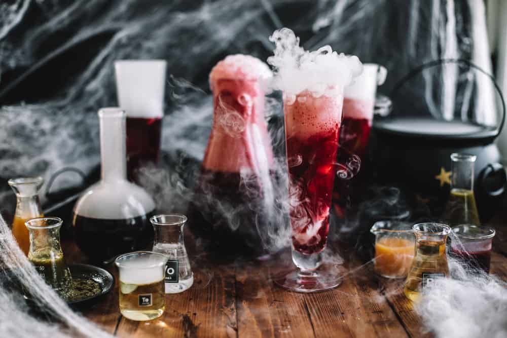 Glasses filled with dry ice with Pomegranate Polyjuice Potion