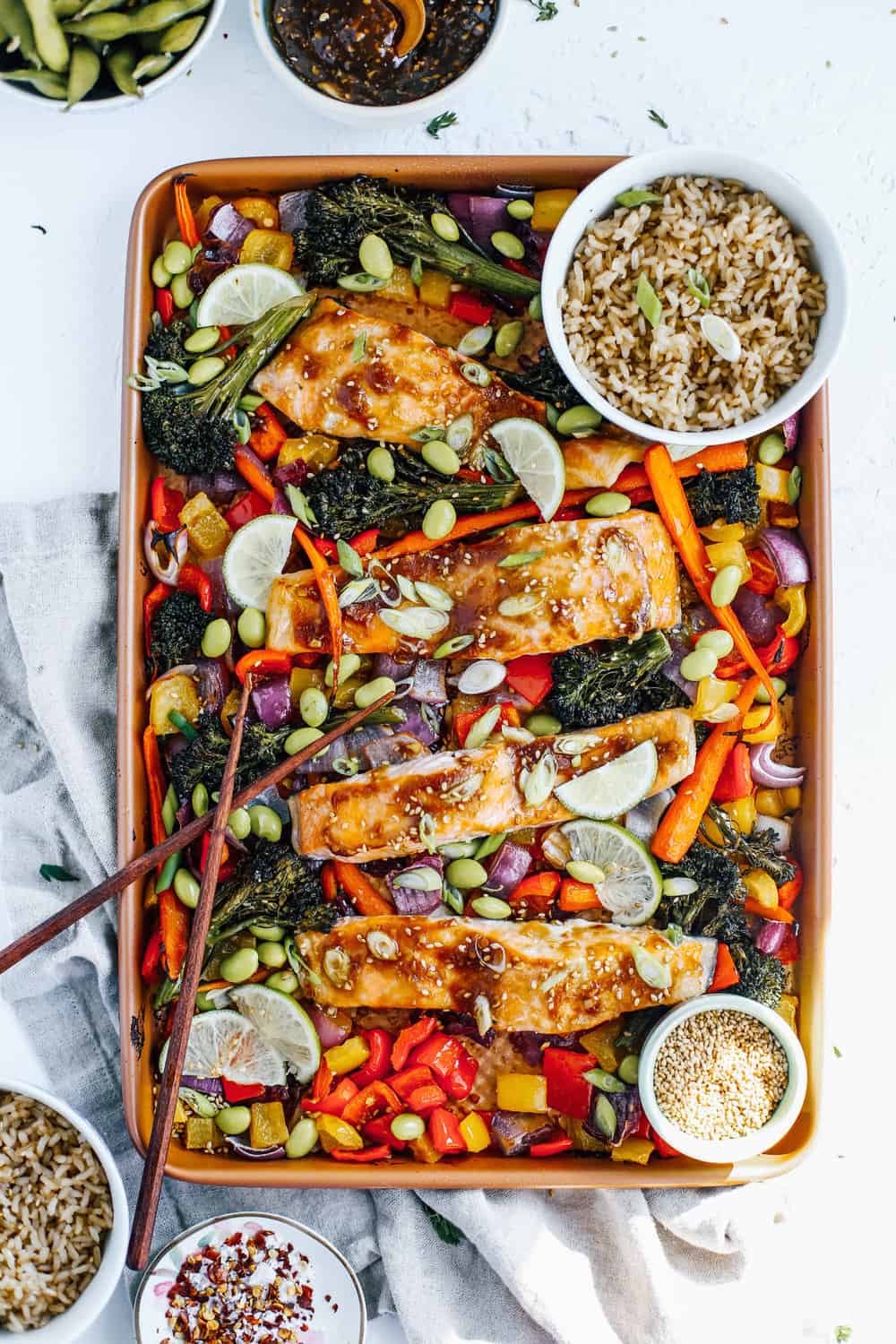 soy, garlic and ginger glazed salmon with broccolini, carrots, peppers and onions on sheet pan