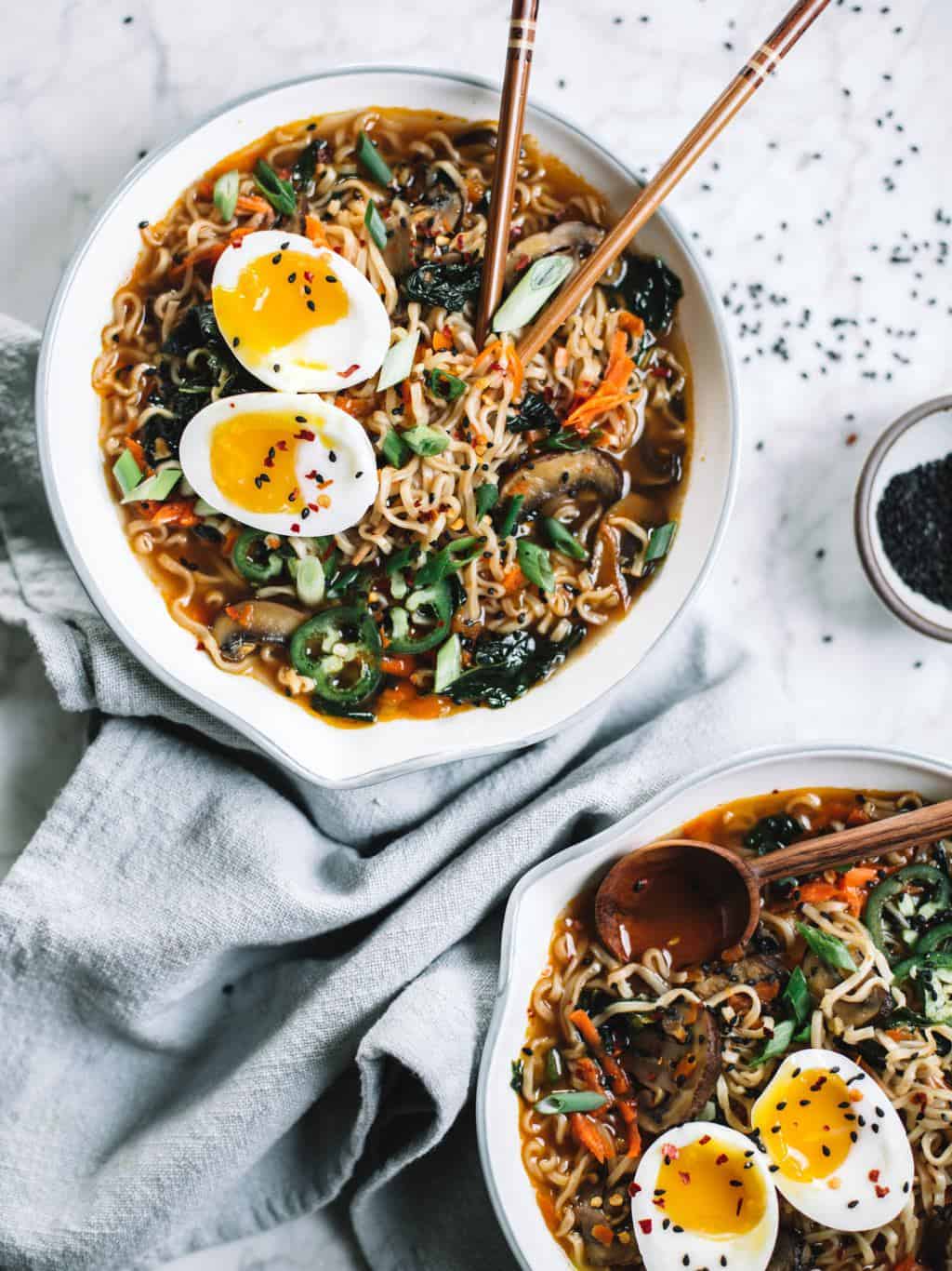 Easy homemade healthy ramen bowls topped with soft boiled eggs, jalapeños and sesame seeds.