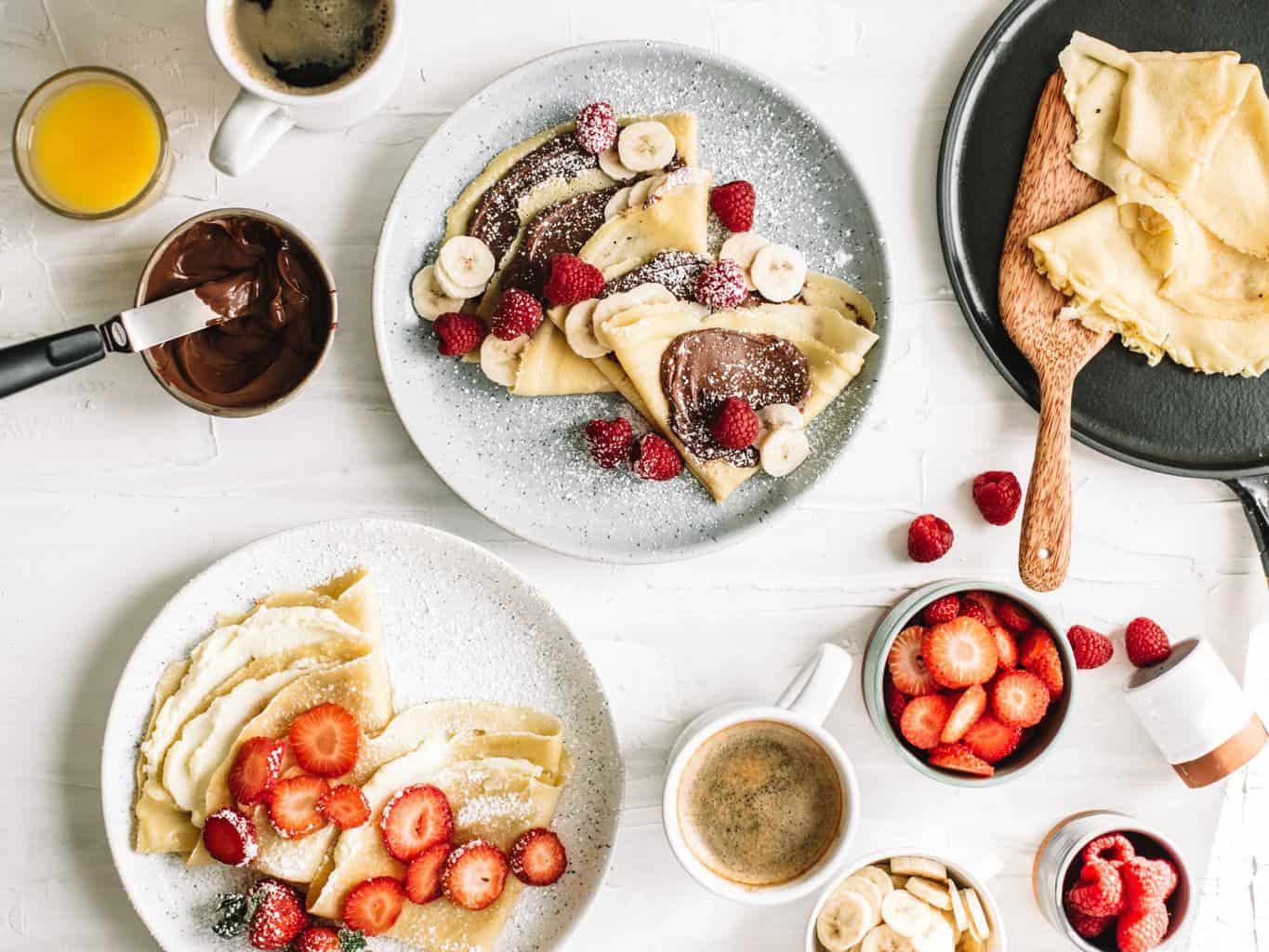 Plates of crepes with toppings. 