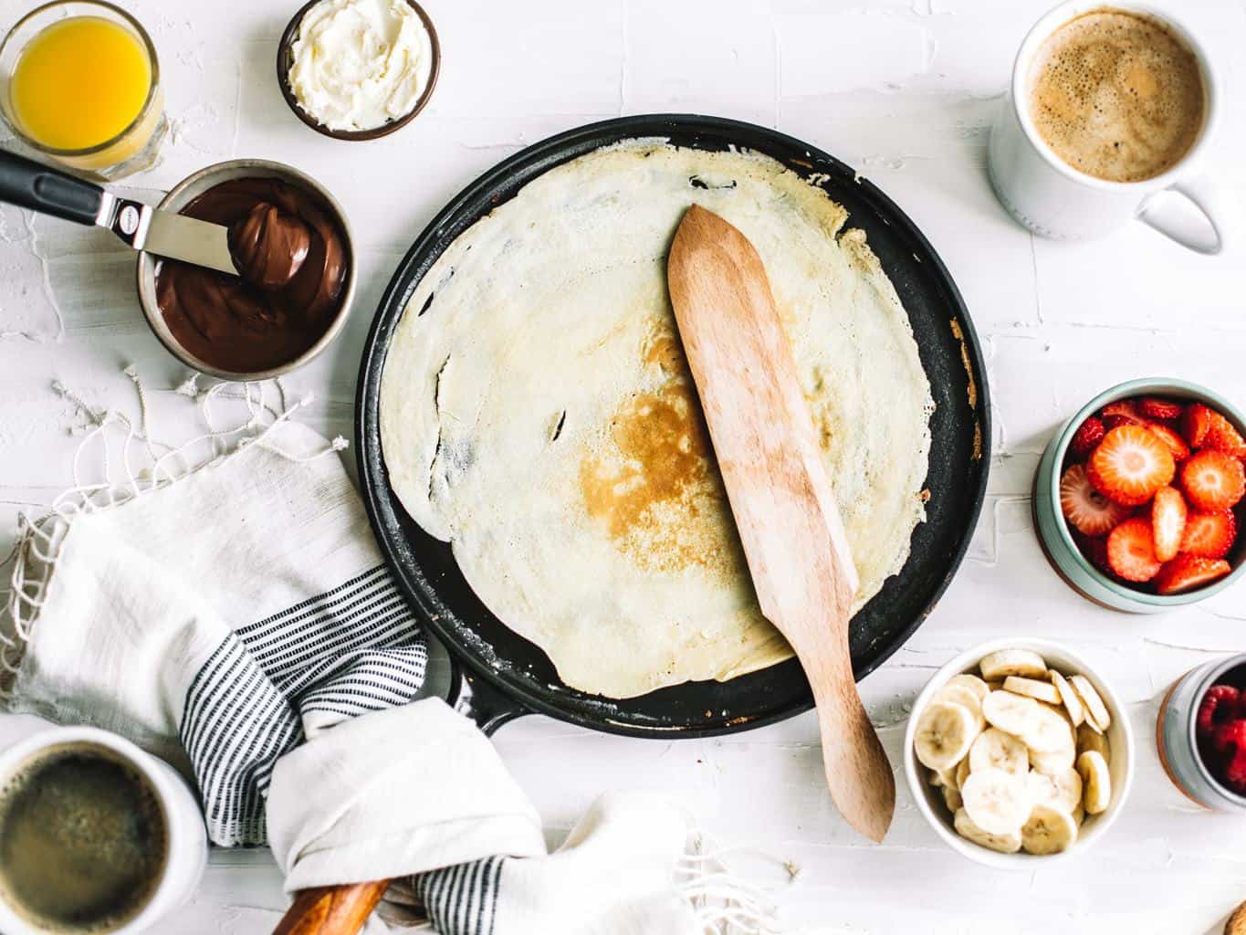 Flipped crepe on a skillet.