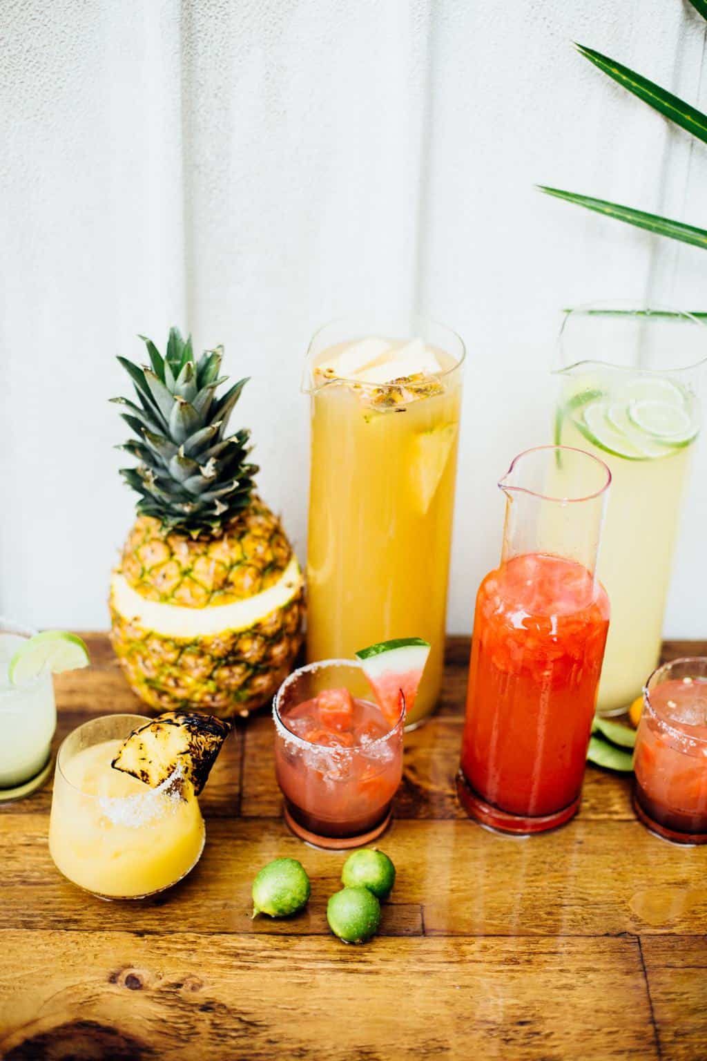 Pitchers and glasses filled with pineapple, watermelon and regular margaritas.