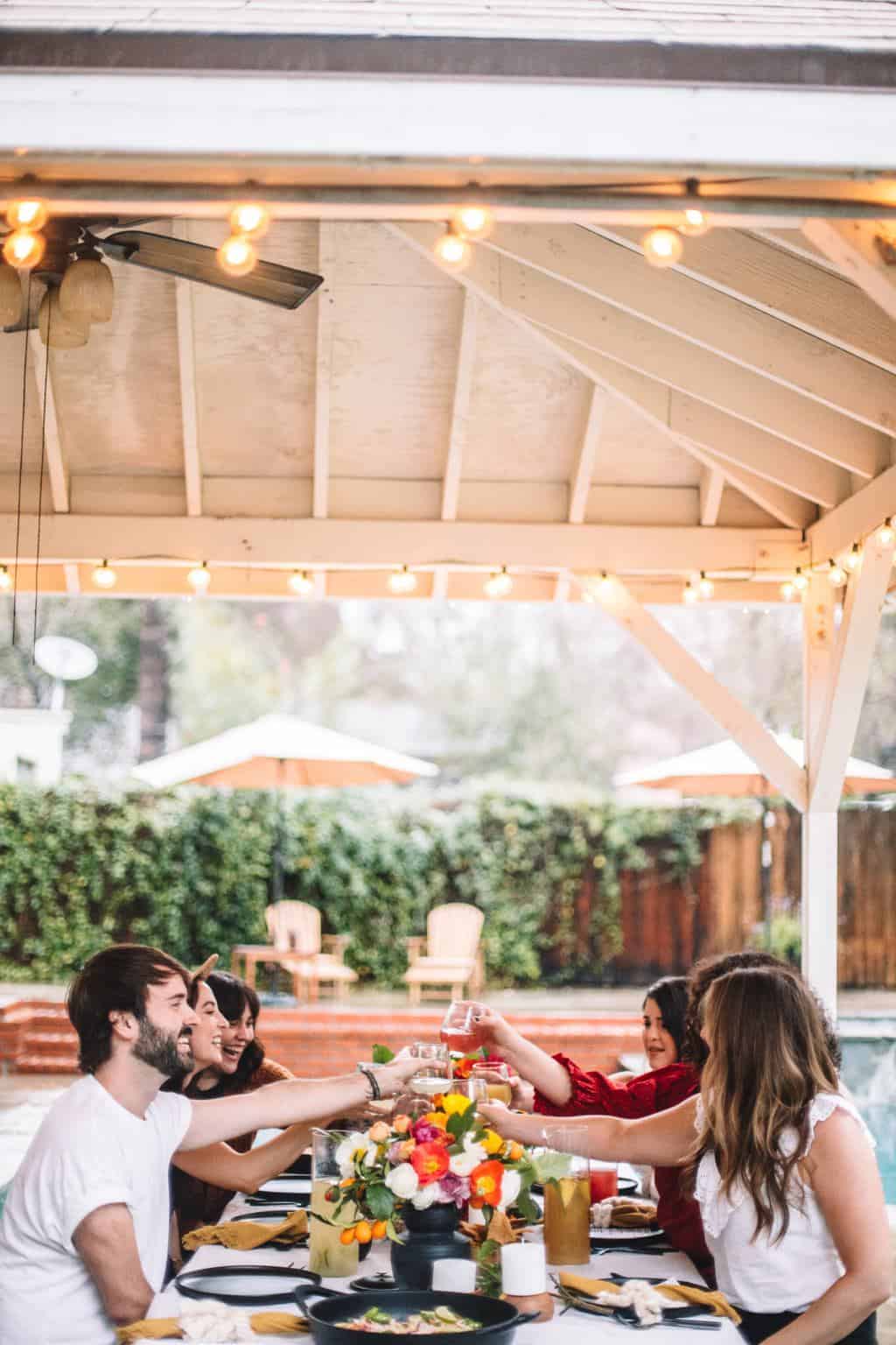 A group of friends sitting at a mexican dinner party. 