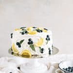 simple lemon blueberry cake with lemon buttercream on cake stand