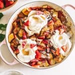 Strawberry and Cream Overnight French Toast in a white dutch oven