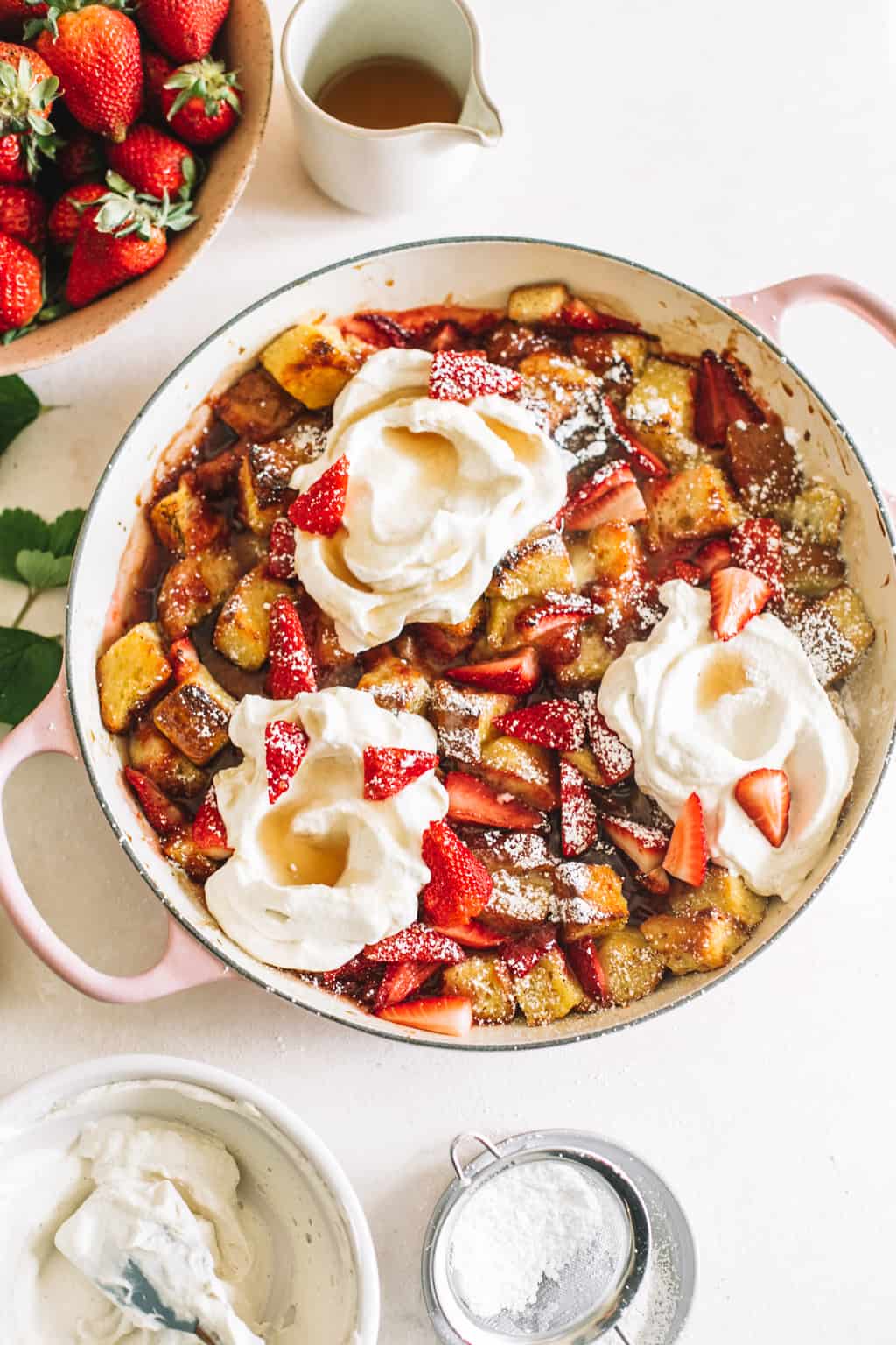 Strawberry and Cream Overnight French Toast in a white dutch oven