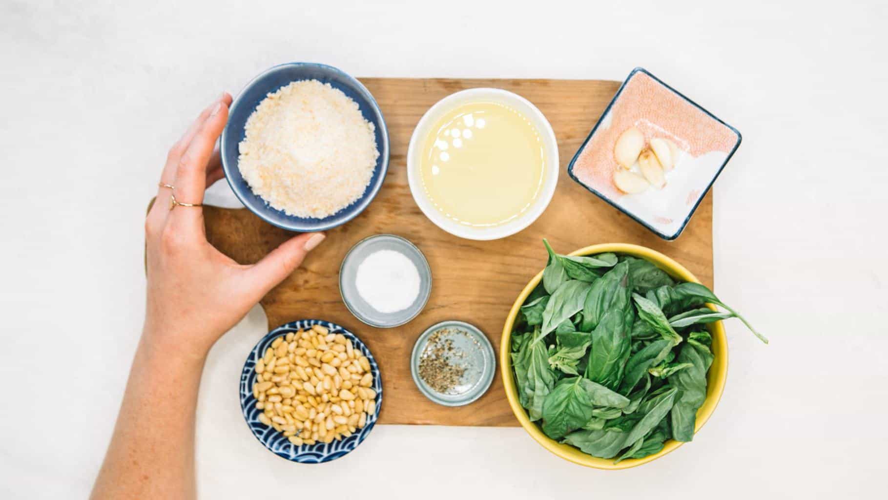 How to make Pesto ingredients in bowls on a wooden board