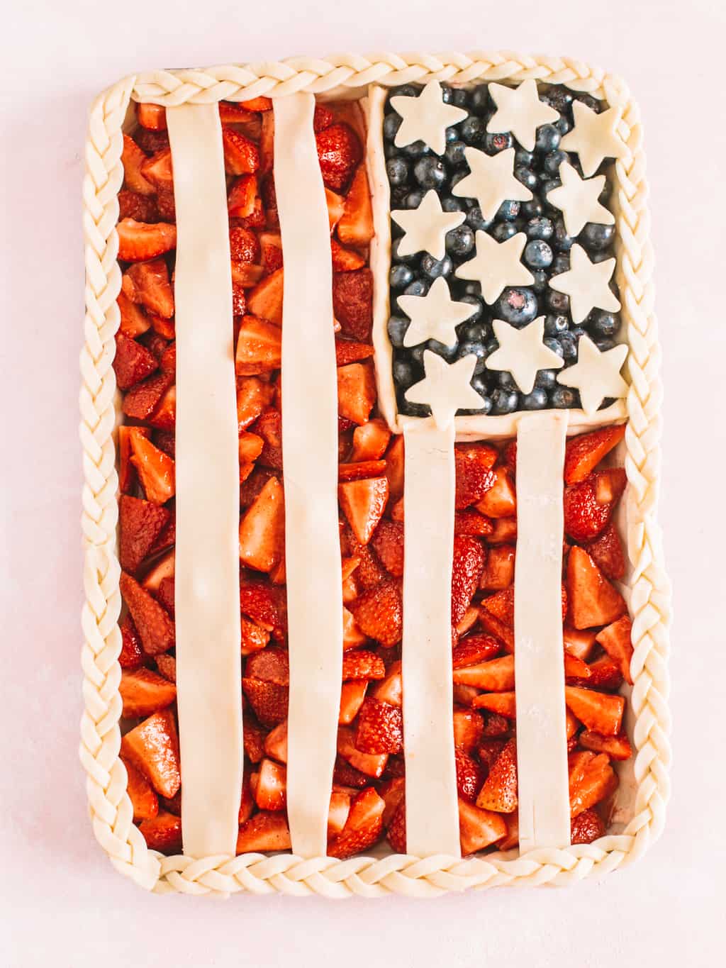 American flag pie made on a cookie sheet with pie dough. 