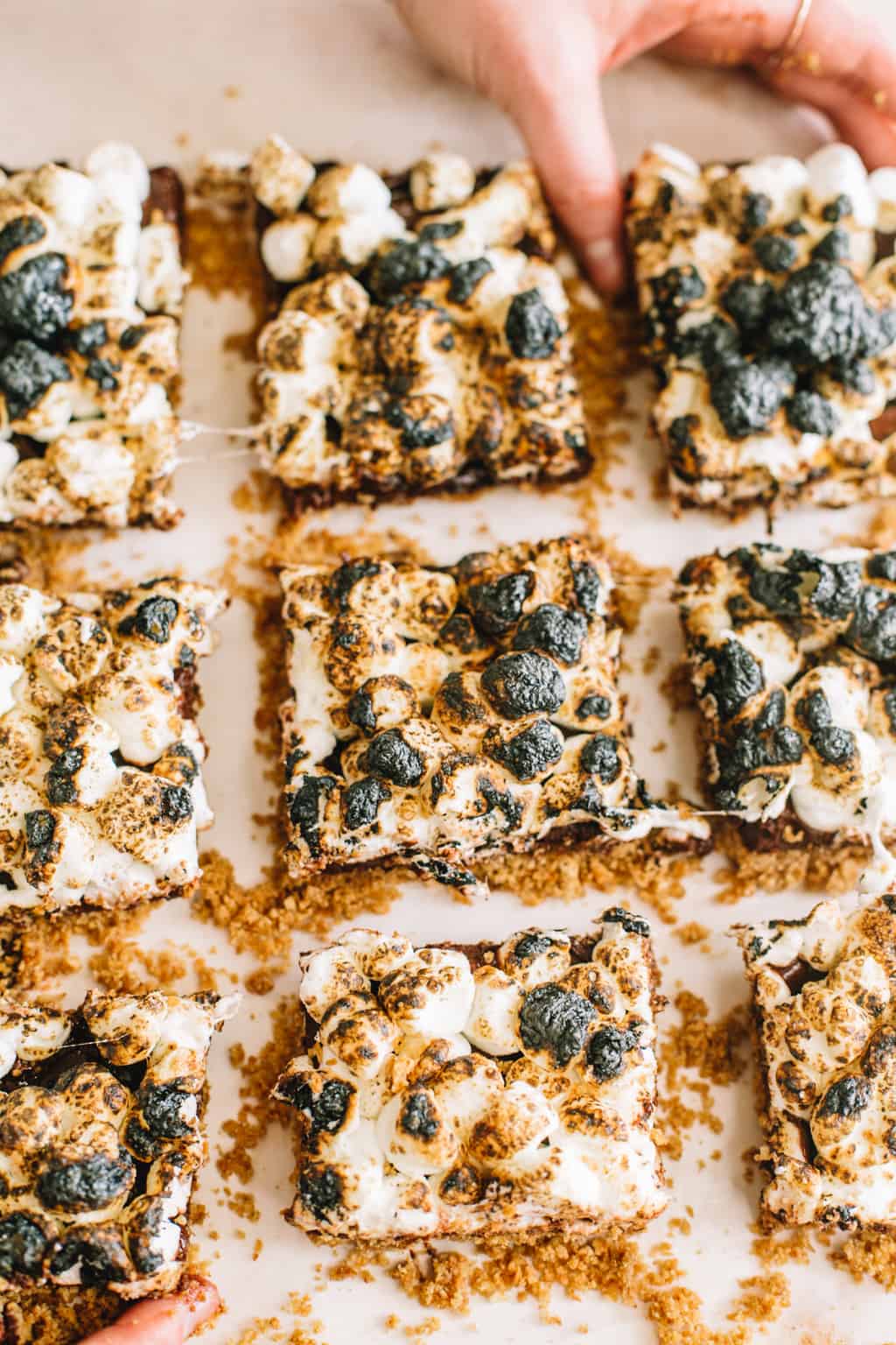 Platter of smores bars with one bar being taken out. 