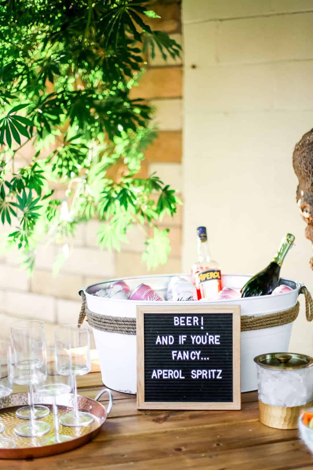 An aperol spritz and beer station for an outdoor movie night. 