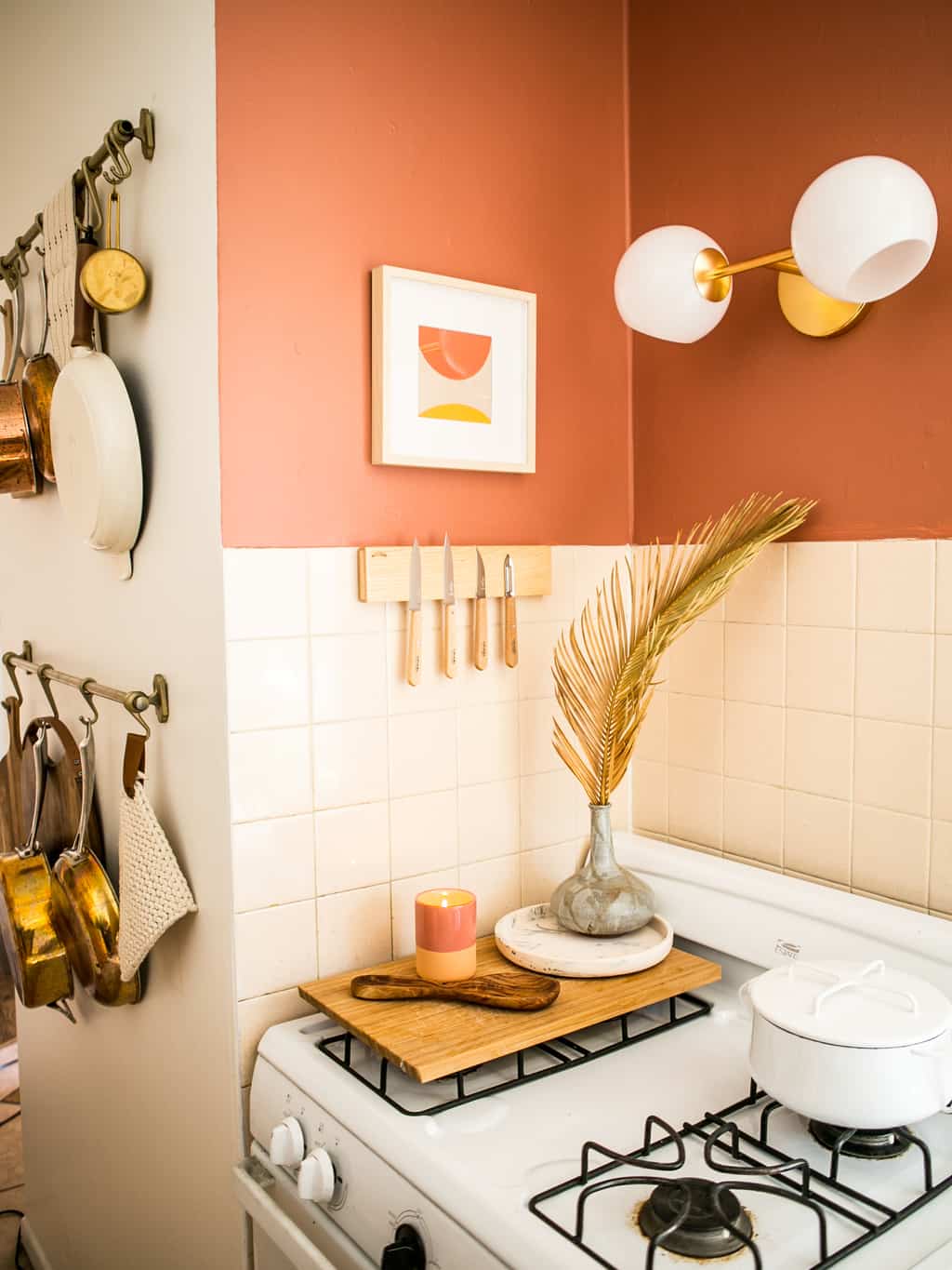 White stove and knife magnet with pan racks. 