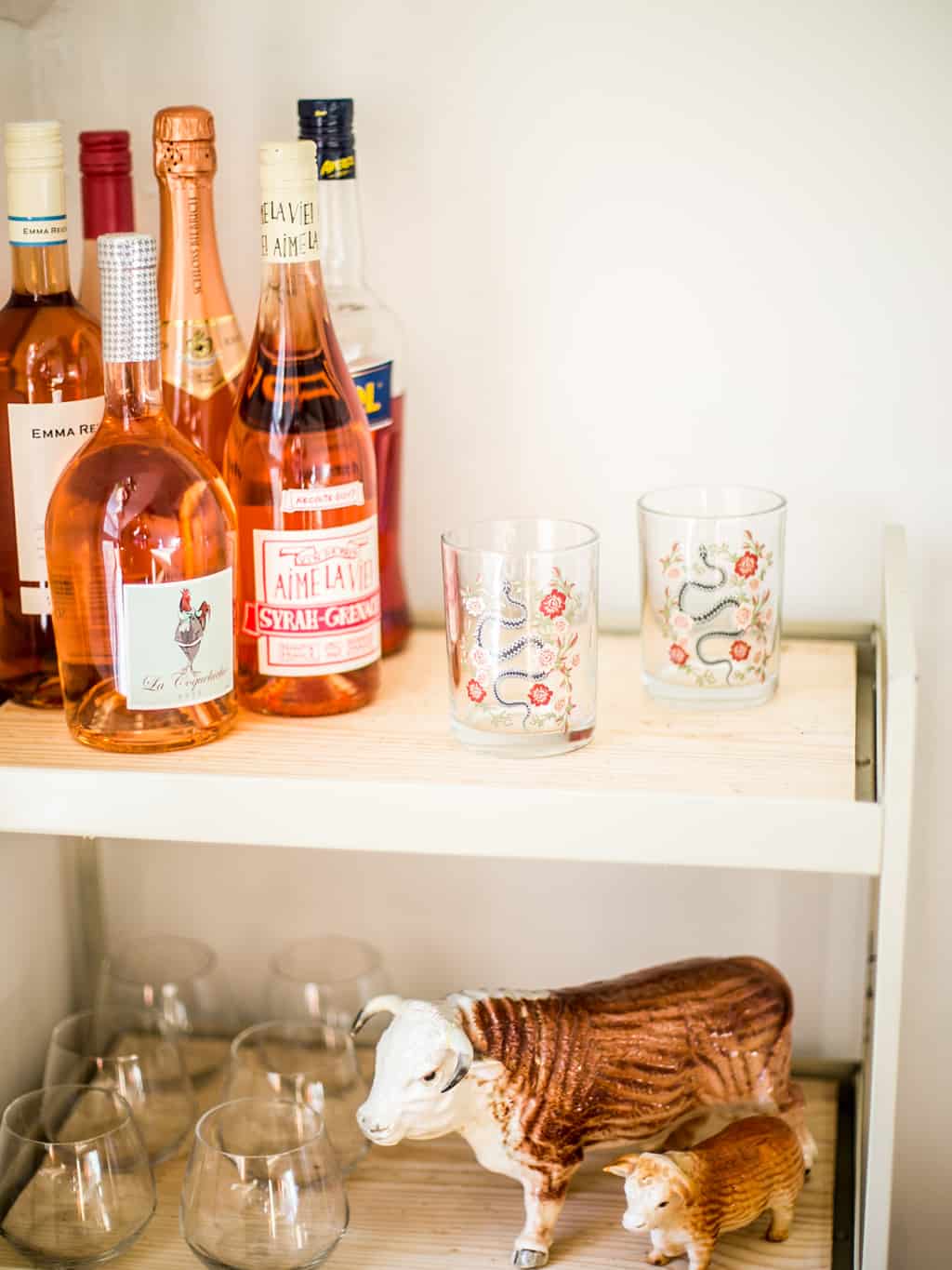 A new bar cart full of rosé and wine glasses. 