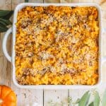 A square casserole dish filled with Pumpkin Mac and Cheese.