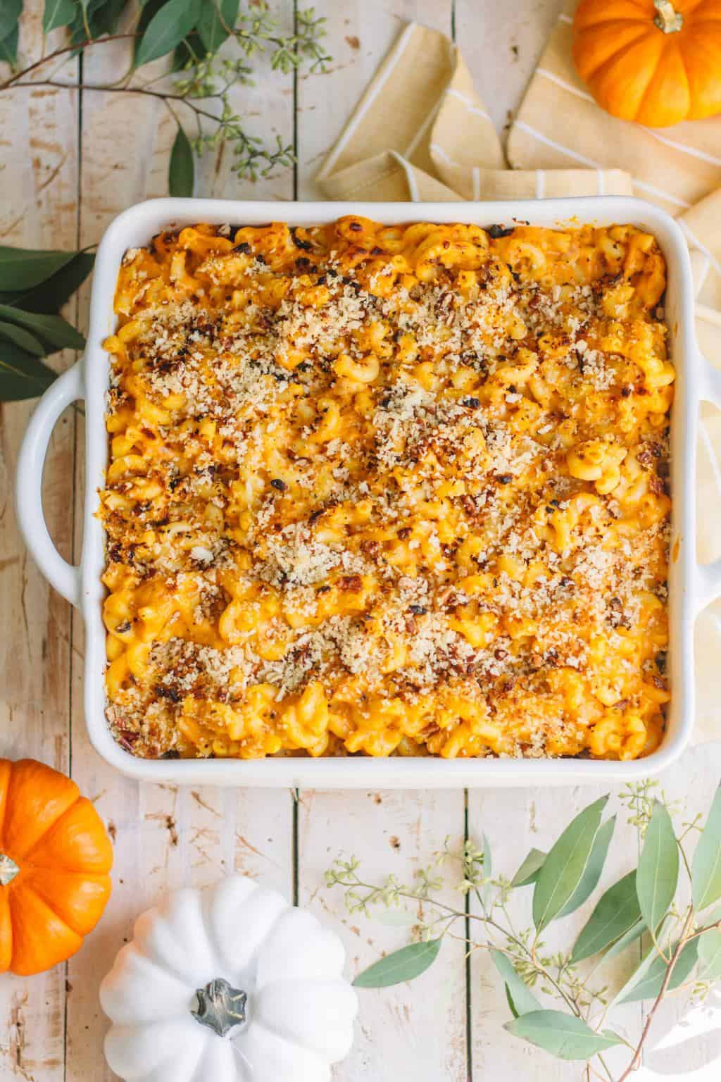 A square casserole dish filled with Pumpkin Mac and Cheese.