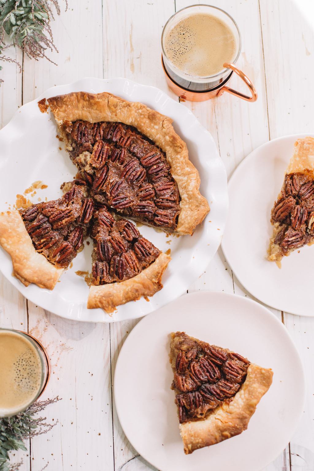 pecan pie recipe with brown sugar in white pie dish with two slices removed and on white plates