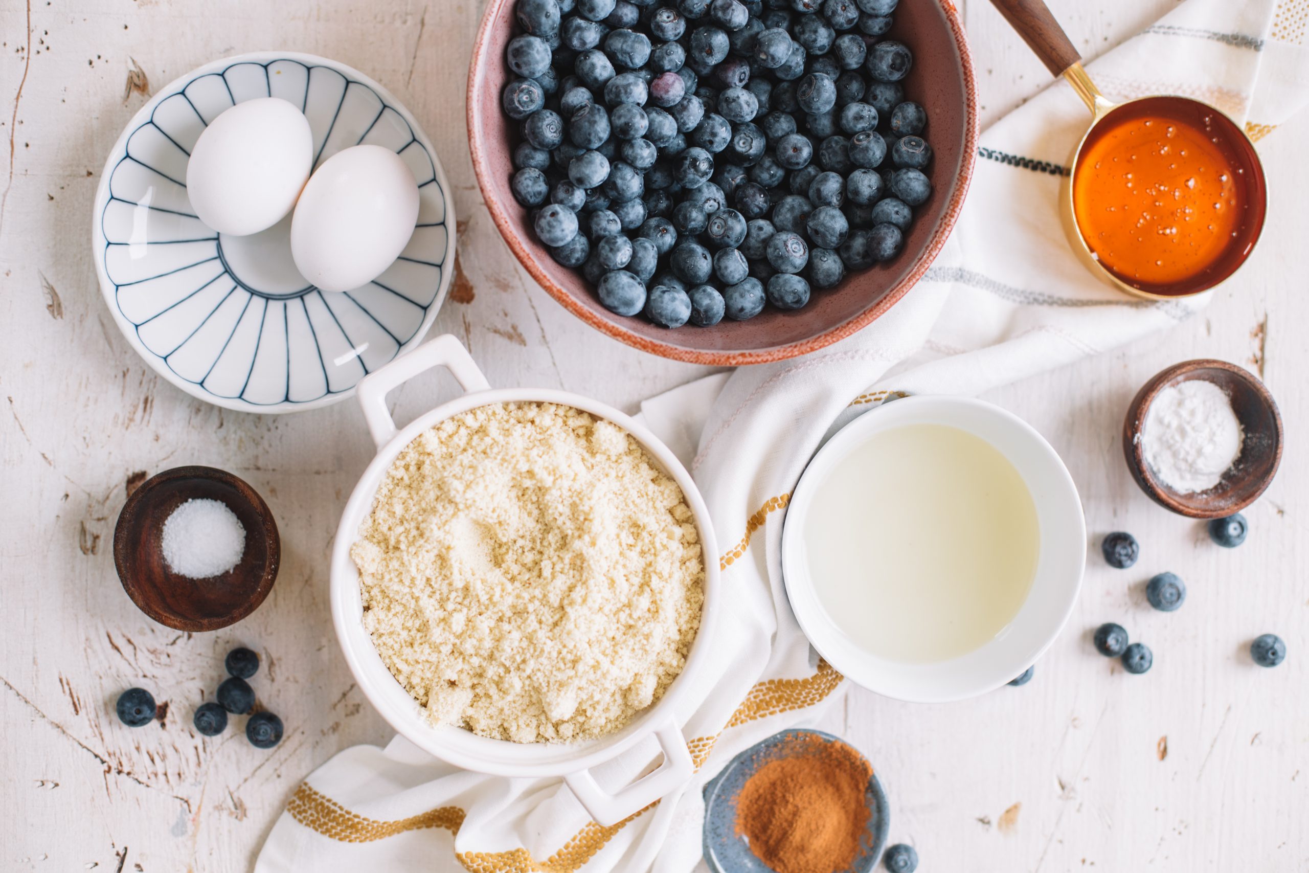 eggs, blueberries, almond milk, almond flour, cinnamon, salt, coconut oil, baking powder, baking soda