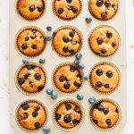 blueberry almond flour muffins in muffin tin