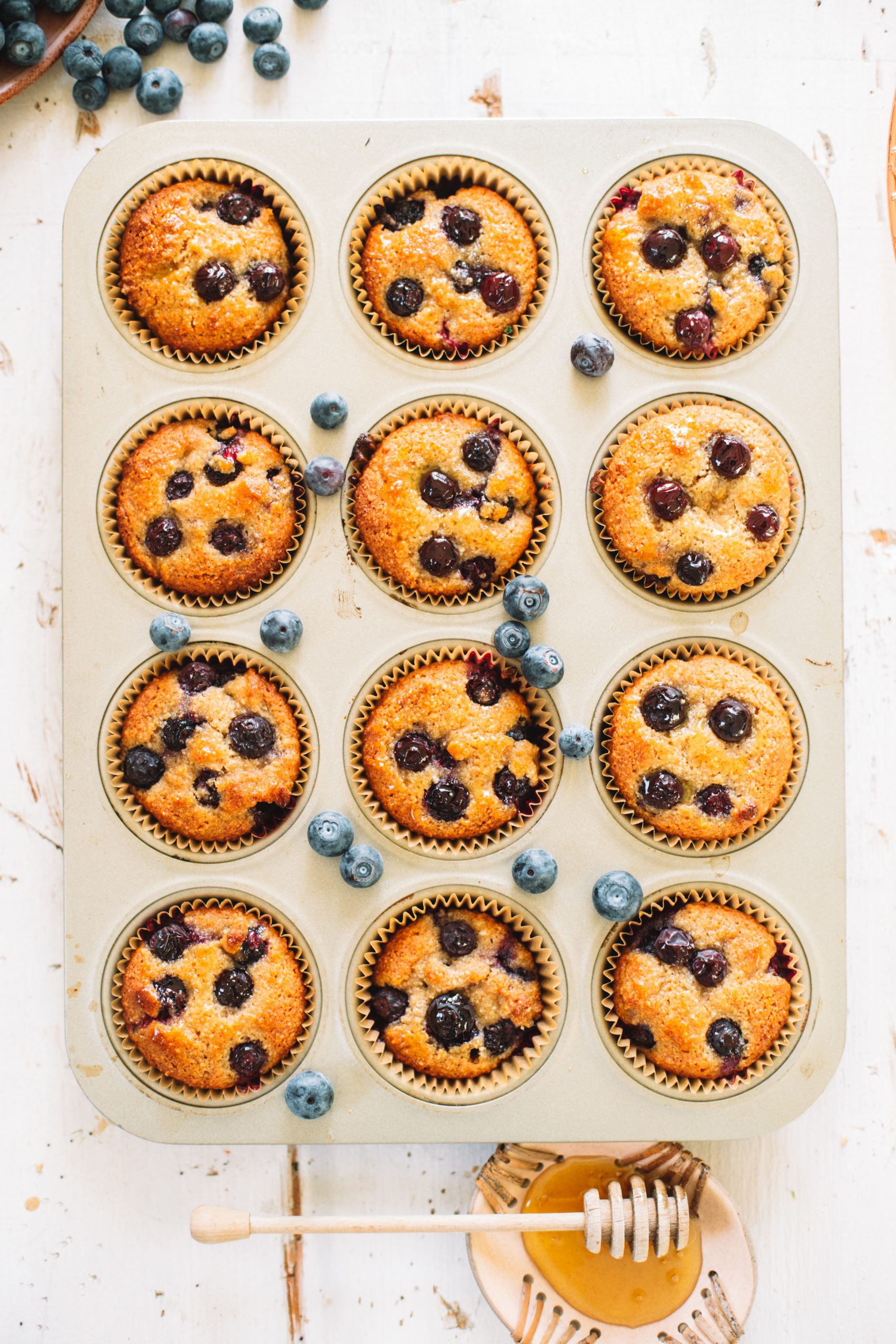 blueberry almond flour muffins in muffin tin