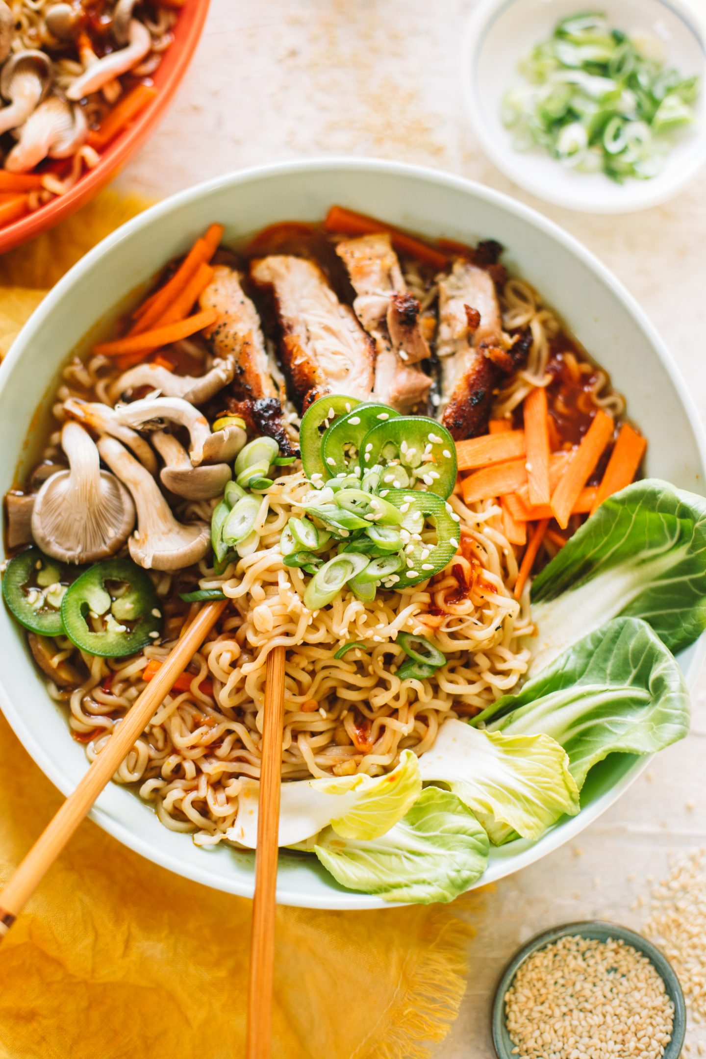 spicy chicken ramen soup in bowl with chopsticks