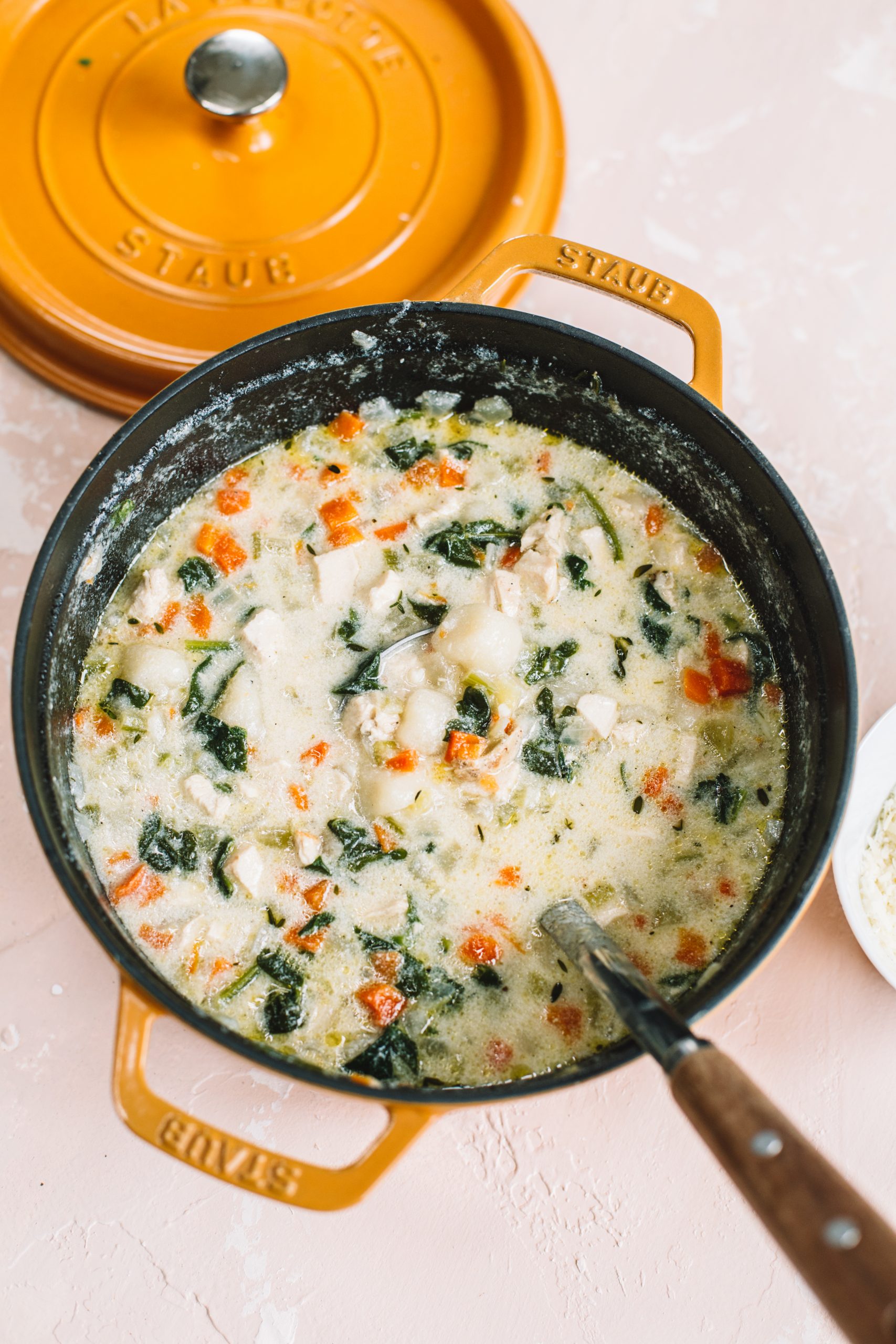 Dutch oven filled with creamy cauliflower gnocchi chicken soup.