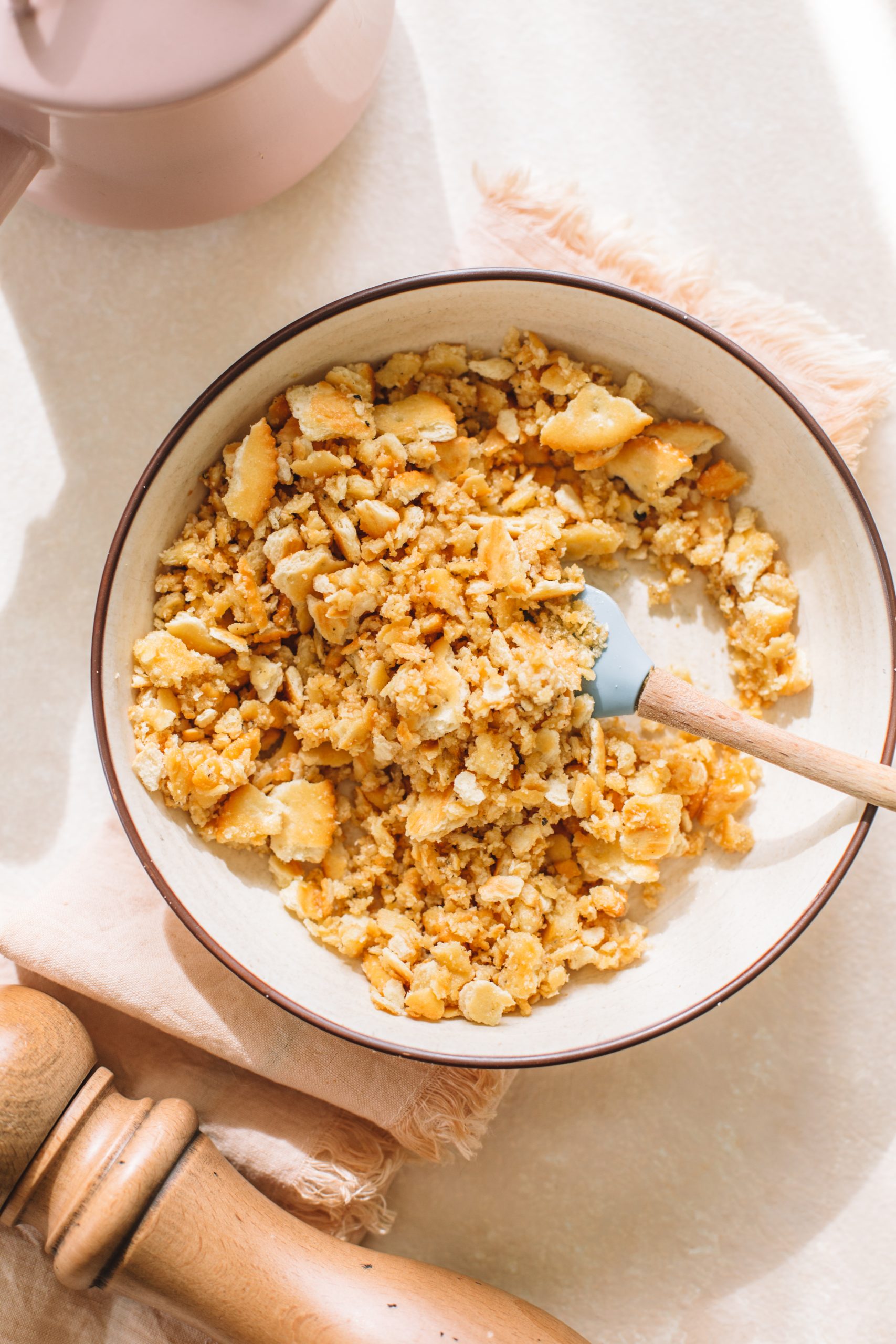 A bowl of crushed cracker topping for the casserole.