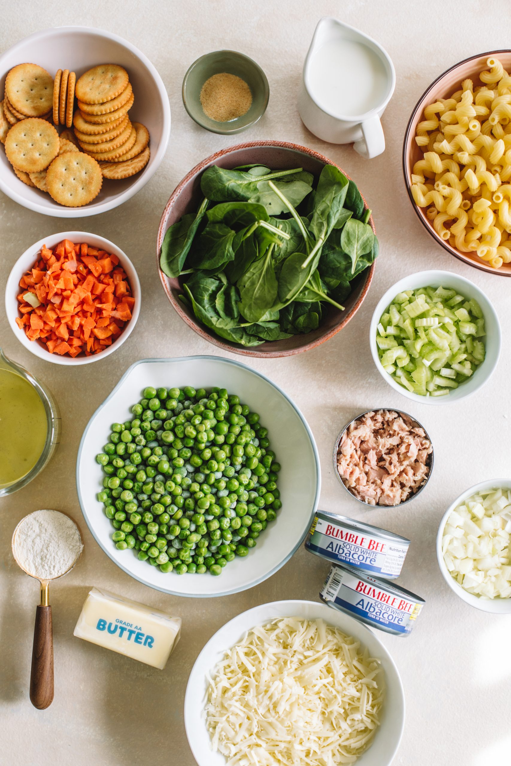 Ingredients for tuna noodle casserole from scratch in small bowls ready to be prepared.