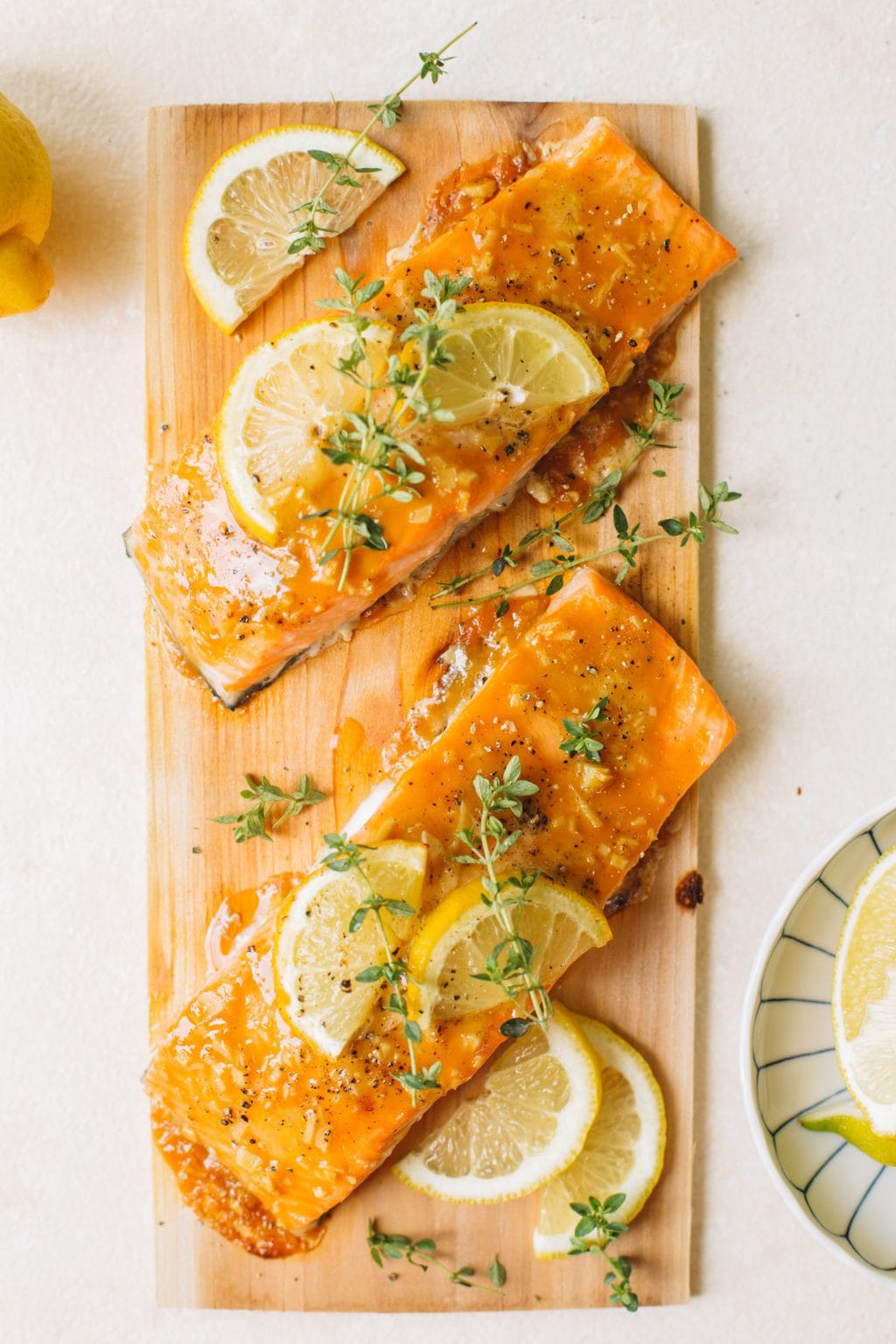 easy cedar planked salmon with lemon slices and fresh thyme