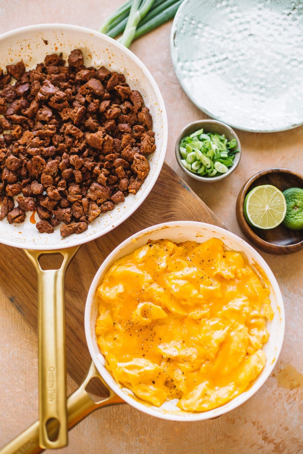 sauteed chorizo and scrambled eggs in two nonstick skillets