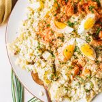 easy egg potato salad recipe in white bowl with gold spoon