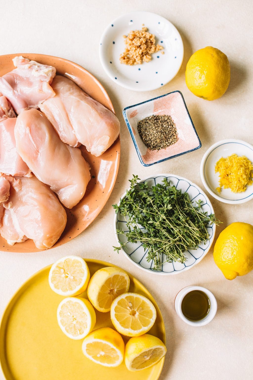 chicken breasts, black pepper, fresh thyme, lemon zest, lemons