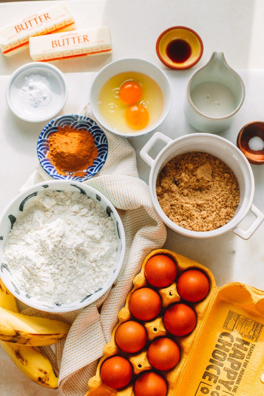 Ingredients in small bowls for banana bread.